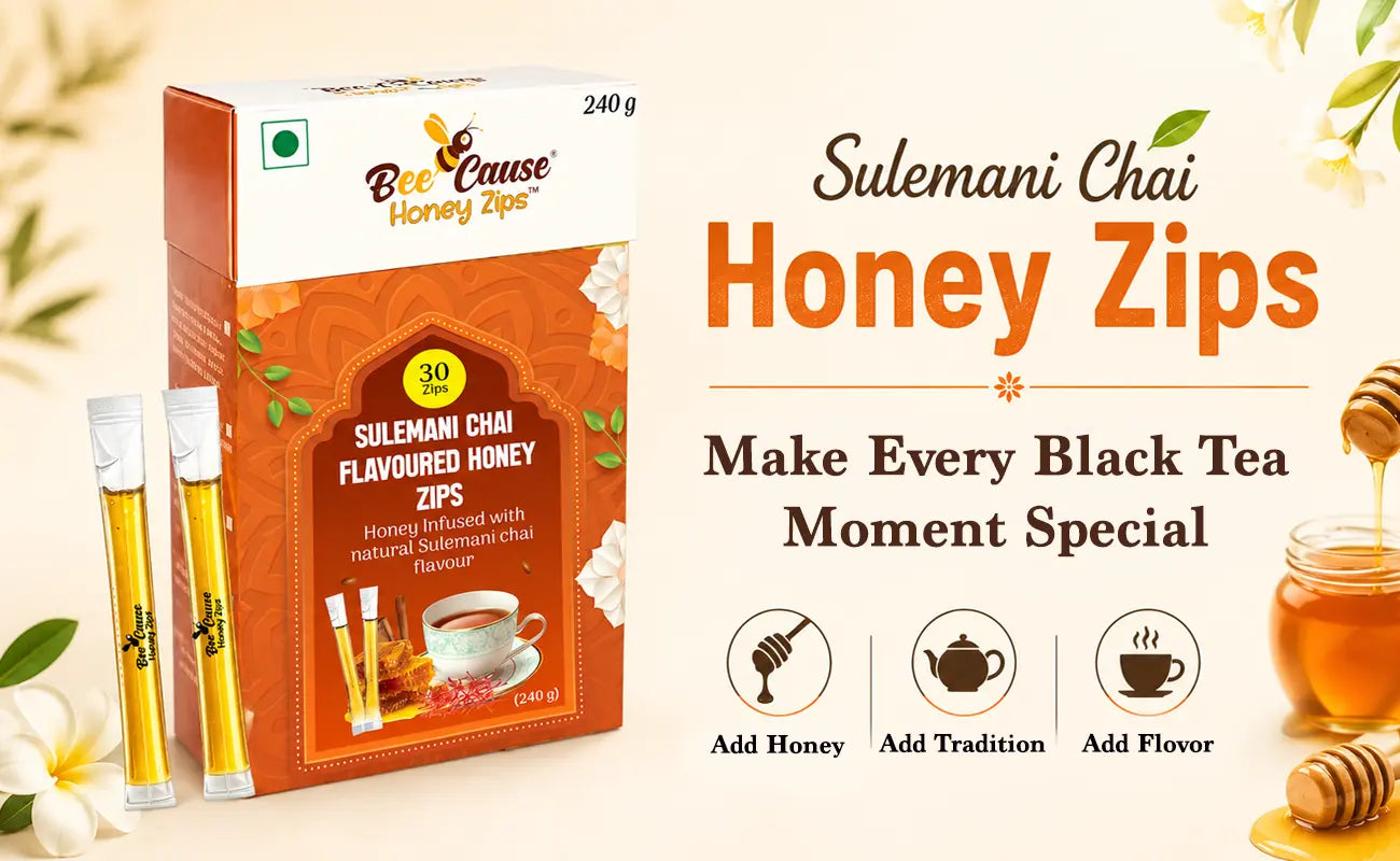 BeeCause Sulemani Chai Flavoured Honey Zips beside a cup of black tea, showcasing the traditional taste of Sulemani Chai blended with premium honey for a convenient wellness drink.