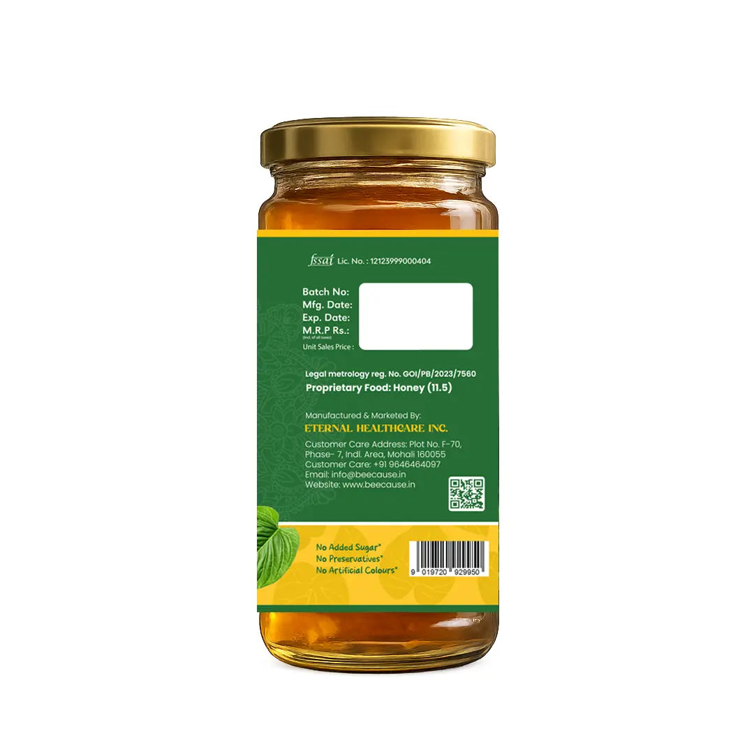 Jar of honey with a green label on a white background