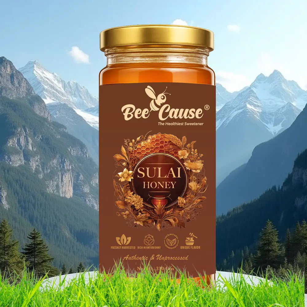 A single jar of Bee Cause Sulai Honey, labeled as authentic and unprocessed, set against a backdrop of majestic snow-capped mountains and a pine forest valley.