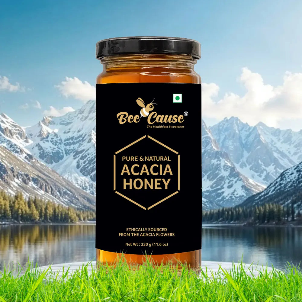 A single jar of Bee Cause Pure & Natural Acacia Honey displayed prominently in front of a scenic background featuring a calm lake and snow-capped mountains.