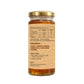 Glass jar with a gold lid containing a health supplement, showing nutritional information and ingredient list on a white background.