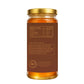 Jar of honey with a gold lid on a white background