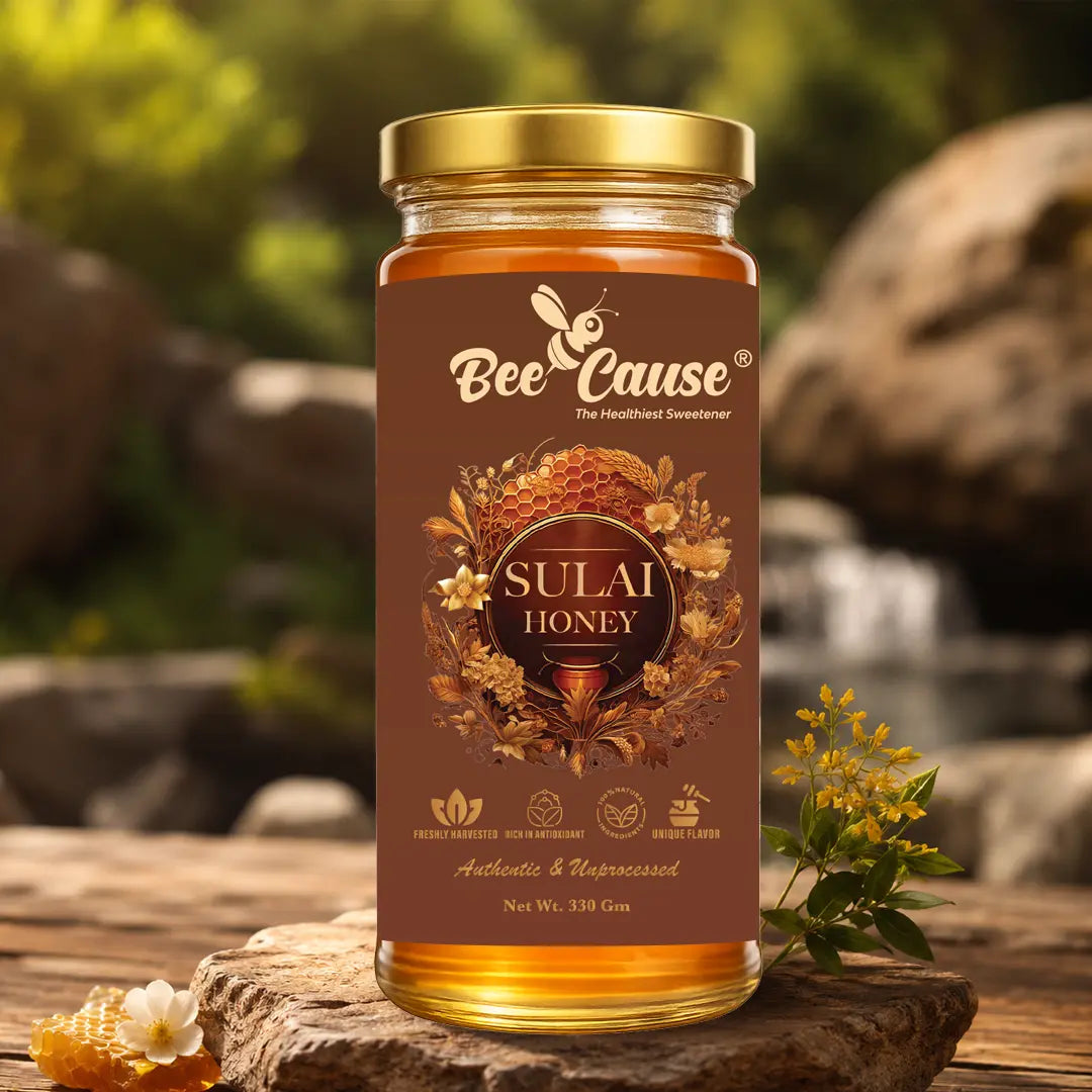 beecause sulai honey placed on rock with natural blurred background
