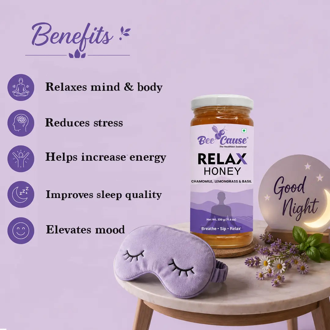 Bee Cause Relax Honey bottle with sleep mask and decorative items on a table against a light purple background