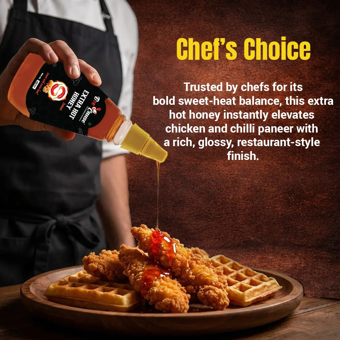 A chef wearing a black apron pours Bee Cause Extra Hot Honey Sauce over a wooden plate of crispy fried chicken tenders and waffles. Text reads "Chef's Choice" and explains that it is trusted by chefs for its bold sweet-heat balance, instantly elevating dishes with a rich, glossy, restaurant-style finish.