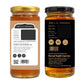 Two amber glass jars of honey shown side by side on a white background, one displaying the gold-colored front label and the other showing the black back label with text details.