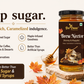 A jar of Bee Cause Brew Nectar (Honey & Mapple) syrup displayed on a rustic wooden board next to a cup of coffee and pancakes, with promotional text on a beige background.