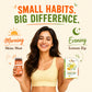 A smiling woman in a pale yellow sports bra holds a jar of honey and a box of lemon honey tips against a light cream background with promotional text reading 'Small Habits. Big Difference.