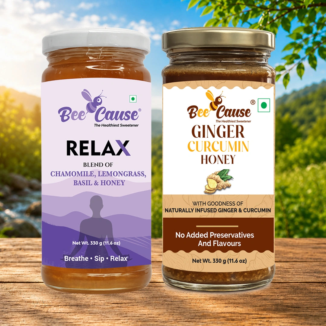 Two jars of Bee Cause herbal honey displayed side-by-side on a wooden surface with a blurred outdoor background. The left jar is 'RELAX' blend of chamomile, lemongrass, basil & honey, with a purple label.
