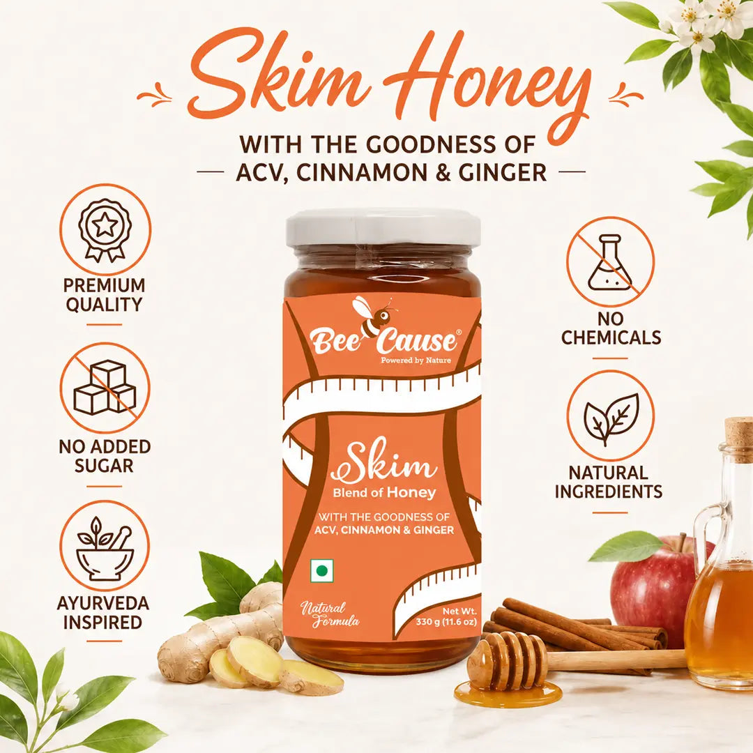 A jar of Bee Cause Skim Honey centered on a light cream background with decorative honeycomb props, ginger, an apple, and text callouts about ACV, cinnamon, ginger, premium quality, no added sugar, no chemicals, and natural ingredients.