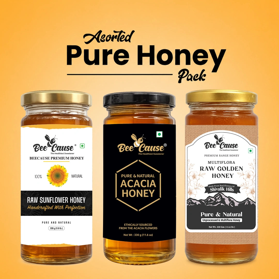Three glass jars of Bee Cause pure and natural honey arranged on a warm orange gradient background with the text 'Asorted Pure Honey Pack' above them. The left jar is Raw Sunflower Honey with a white label and gold lid, the middle jar is Acacia Honey with a black label and black lid, and the right jar is Raw Golden Honey with a white label and gold lid.