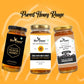 Three glass jars of Bee Cause honey arranged side by side on a warm yellow-orange background with decorative abstract lines and the text 'Purest Honey Range' at the top. The left jar is Pure Acacia Honey with a black label; the center jar is Raw Sunflower Honey with a white label and gold lid; the right jar is Raw Golden Honey with a brown label and gold lid.