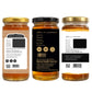 Three glass jars of honey shown from the front, back, and side on a plain white background. The center jar is labeled front-facing with a black label and gold lid, while the left and right jars show the back and side views with white labels and gold lids.