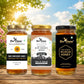 Three jars of honey from Bee Cause with labels on a wooden surface and natural background