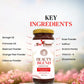 Bee Cause Beauty Blend superfood jar with key ingredients listed on a blurred floral background