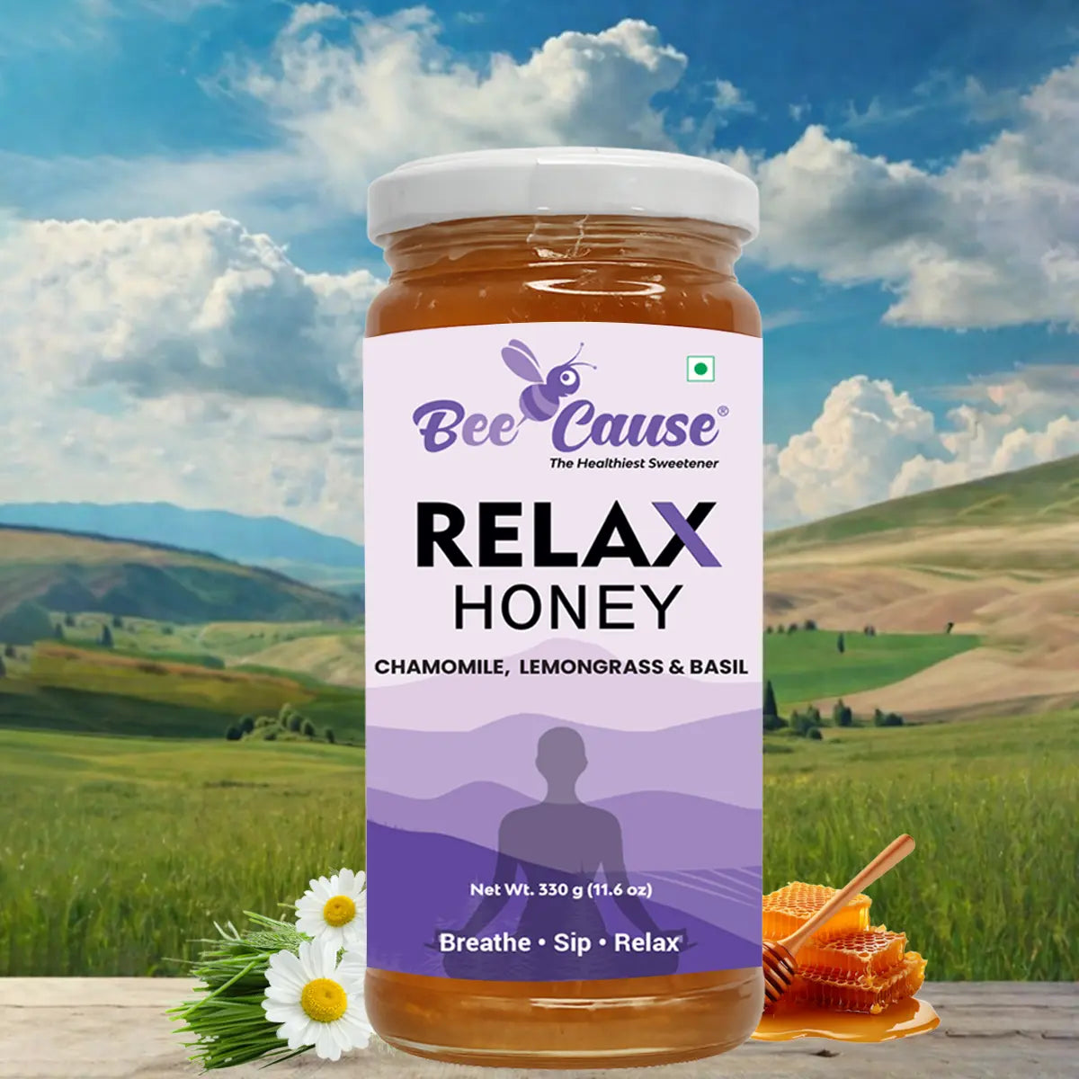Bee Cause Relax Honey jar featuring chamomile, lemongrass, and basil, displayed against a serene mountain valley landscape with fresh honeycomb and daisies.