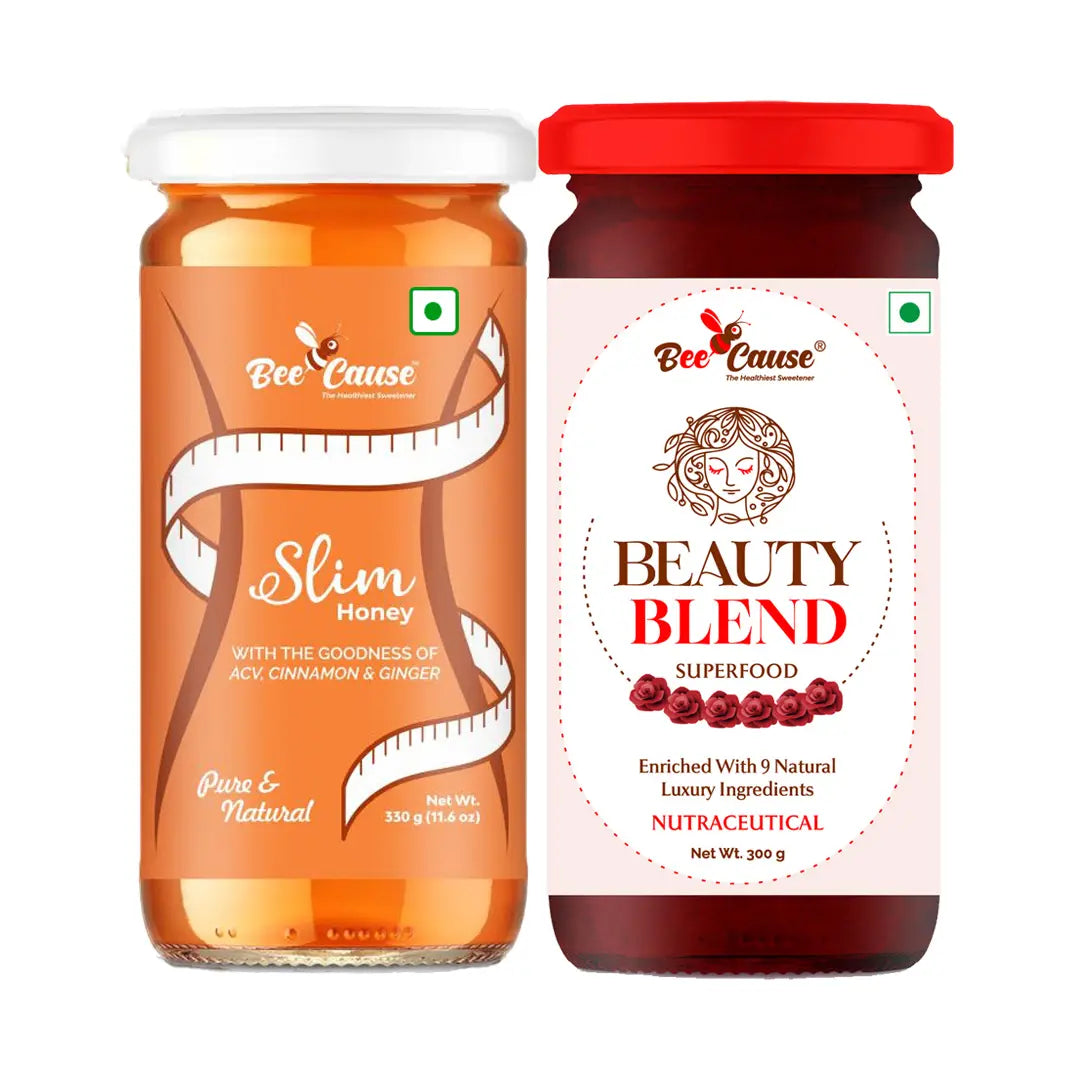 Studio shot of Bee Cause Slim Honey (with ACV, Cinnamon & Ginger) next to Bee Cause Beauty Blend Superfood honey. Both jars display the green vegetarian symbol.