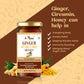 A graphic listing the health benefits of Ginger Curcumin Honey, such as immunity boosting, anxiety relief, and nausea control, displayed next to fresh ginger and turmeric powder.