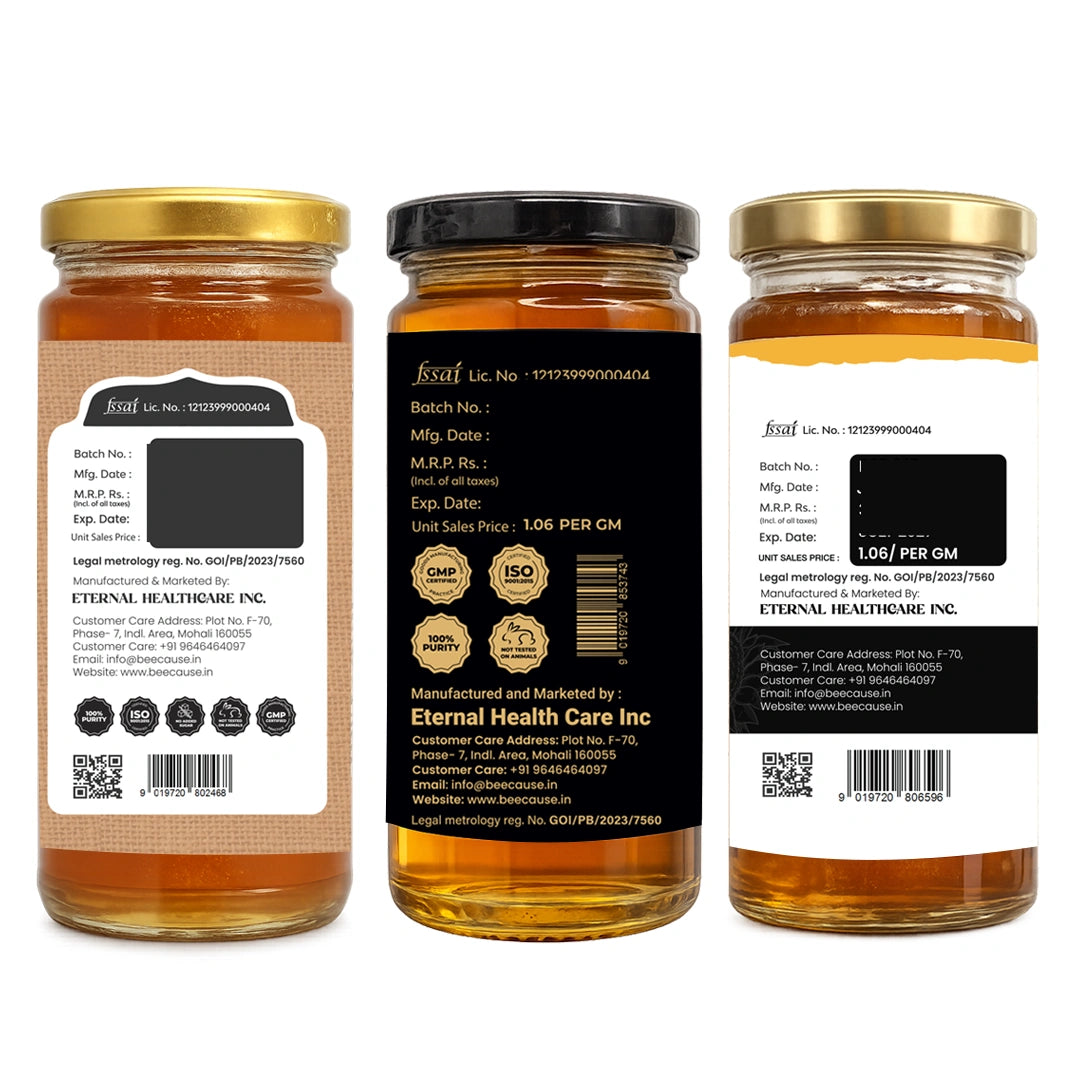 Three glass jars of honey shown on a white background, displaying the front label, back label, and side label. The jars contain golden honey and are sealed with gold and black lids.