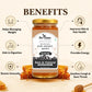A jar of Bee Cause Raw Golden Honey centered on a warm beige background with the word BENEFITS above it and six circular benefit icons around it. The jar has a gold lid, a white and black label, and honey-colored contents visible through the glass.