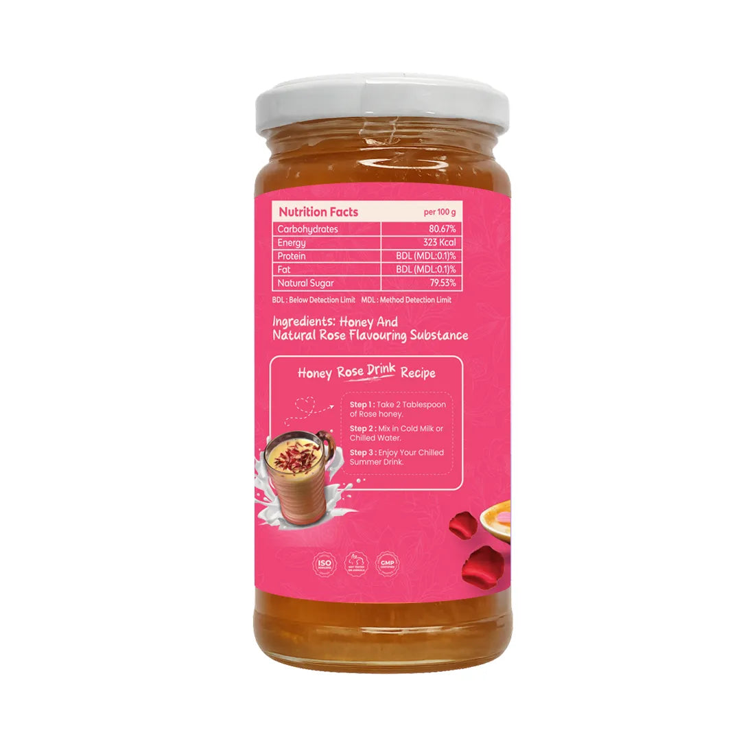 A glass jar of honey drink mix with a white lid and a bright pink label, shown on a plain white background. The label features a nutrition facts section, an ingredients list, and a recipe box with an illustration of a prepared drink.