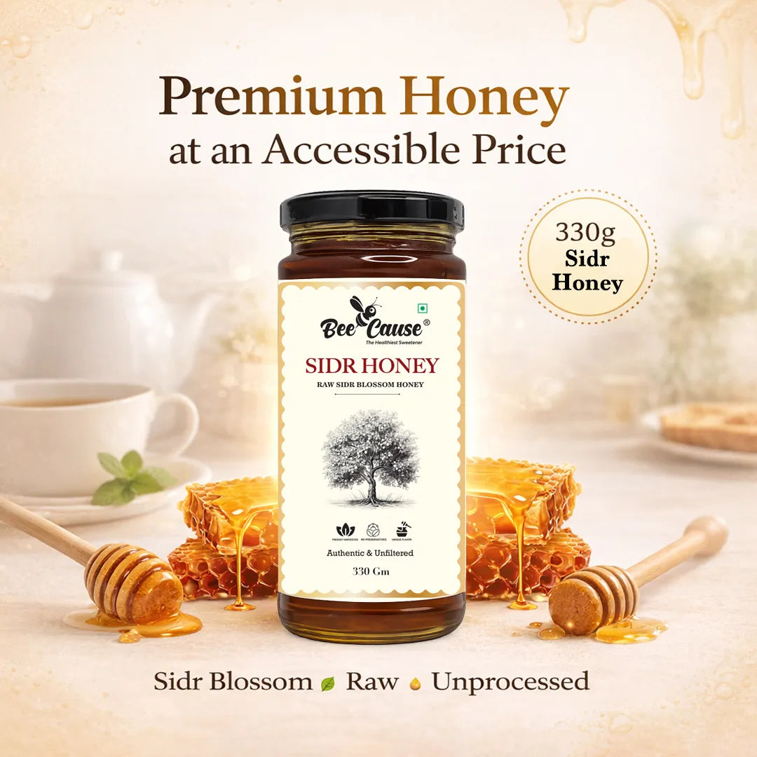 A jar of Bee Cause Sidr Honey is centered against a warm, softly blurred background with honey dripping, a cup of tea, and honeycombs. Text above reads 'Premium Honey at an Accessible Price' and '330g Sidr Honey', with 'Sidr Blossom Raw Unprocessed' at the bottom.