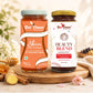 Two jars of Bee Cause honey and superfood blend displayed on a wooden cutting board with ginger, cinnamon, and honeycomb props. The left jar is 'Skim Blend of Honey' with an orange label and light blue cap, and the right jar is 'BEAUTY BLEND SUPERFOOD' with a white label and gold cap.