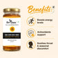 A jar of Bee Cause Raw Sunflower Honey on a light beige background with promotional text and benefit icons. The jar has a white label with a sunflower graphic and a gold lid.