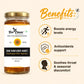 Jar of honey with 'Bee Cause' branding and honey benefits listed on a beige background